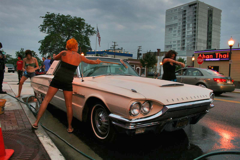 Illustration for article titled Noir Leather Bikini Car Wash Meetup Pictures